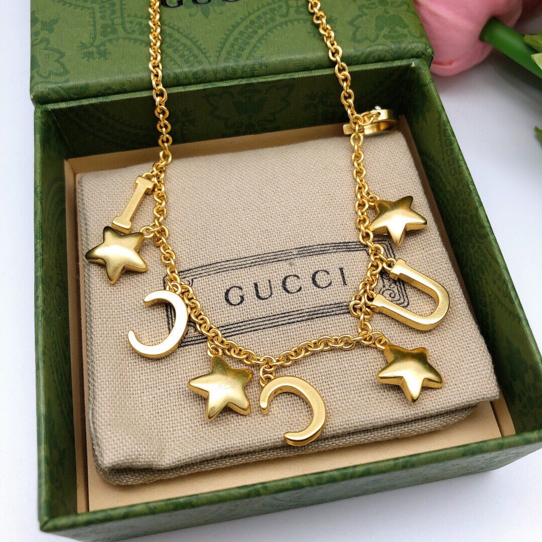 Double-G Emblem Pendant Necklace in Polished Metal-Tone – Crystal Detail – Design 004 close-up detail