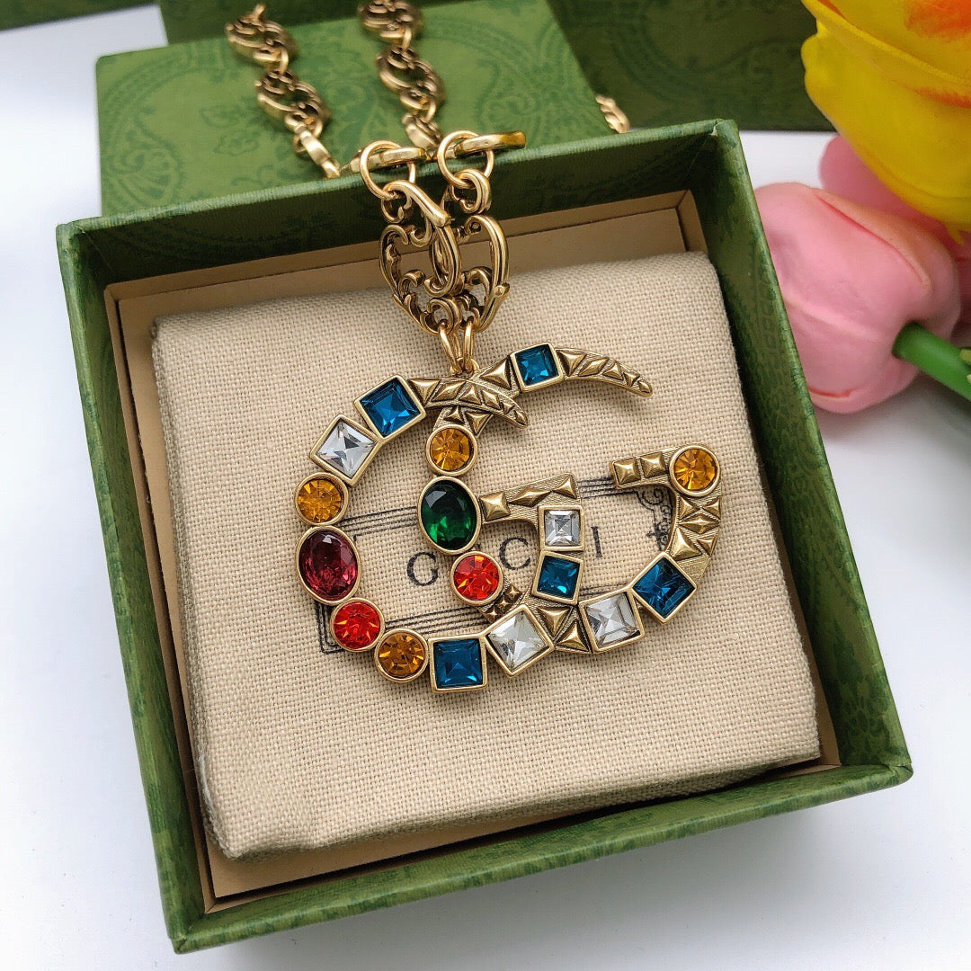 Double-G Emblem Pendant Necklace in Polished Metal-Tone – Crystal Detail – Design 003 detail view
