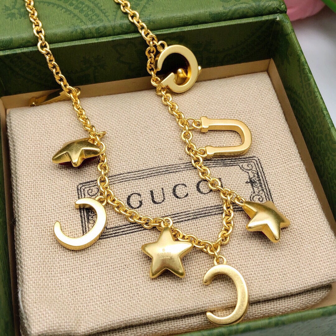 Double-G Emblem Pendant Necklace in Polished Metal-Tone – Red Detail styled product view