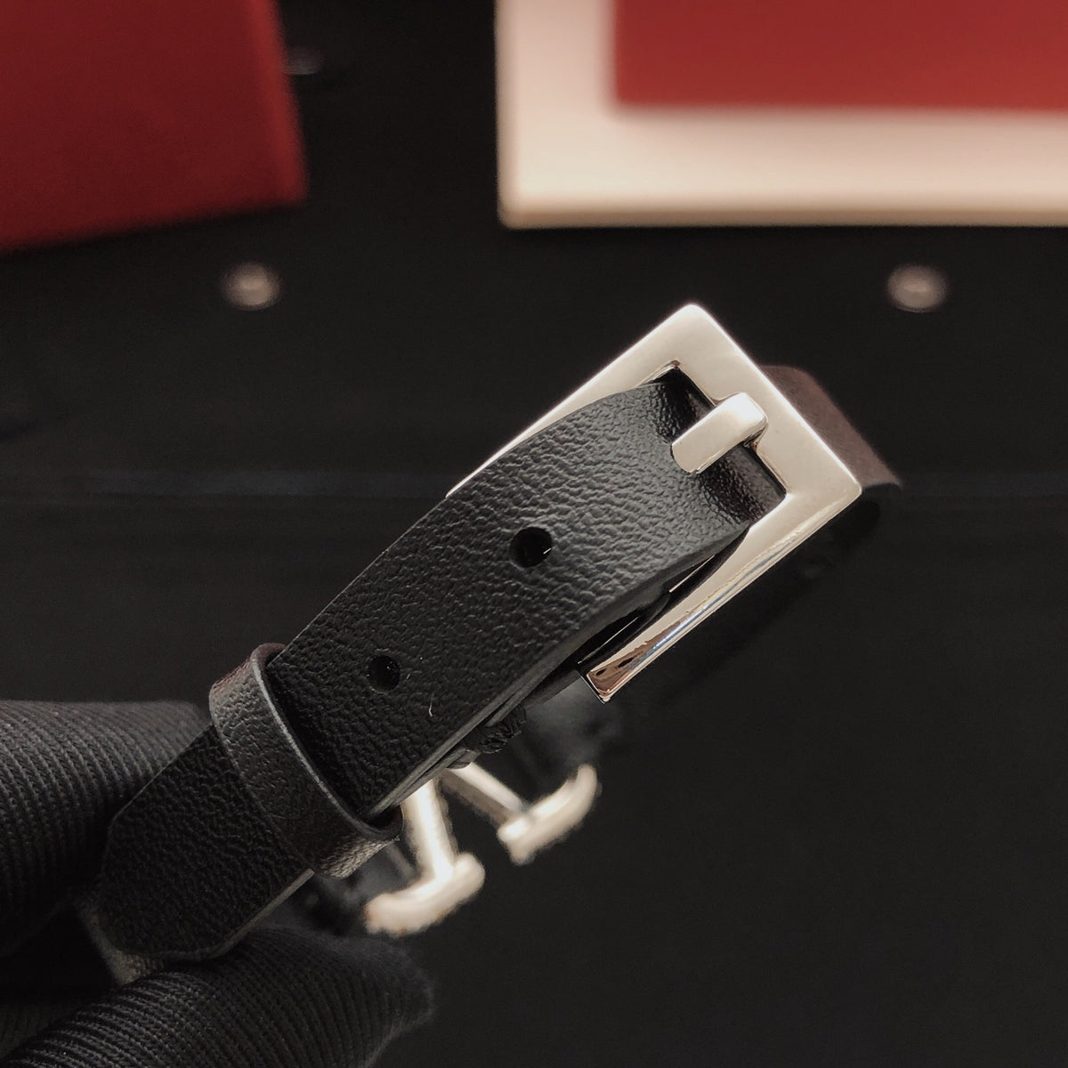 Signature Emblem Bracelet in Gold-Tone – Black close-up view