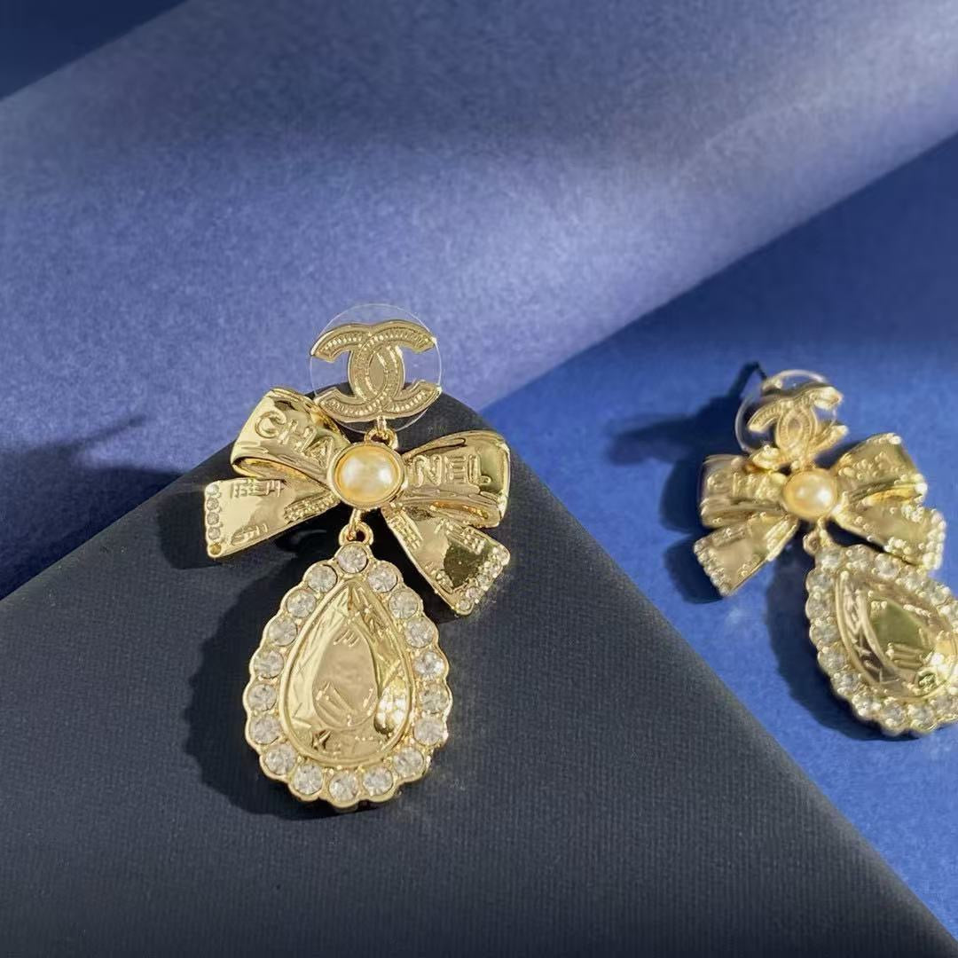 Double-C Emblem Stud Earrings in Gold-Tone – Design 038 close-up detail