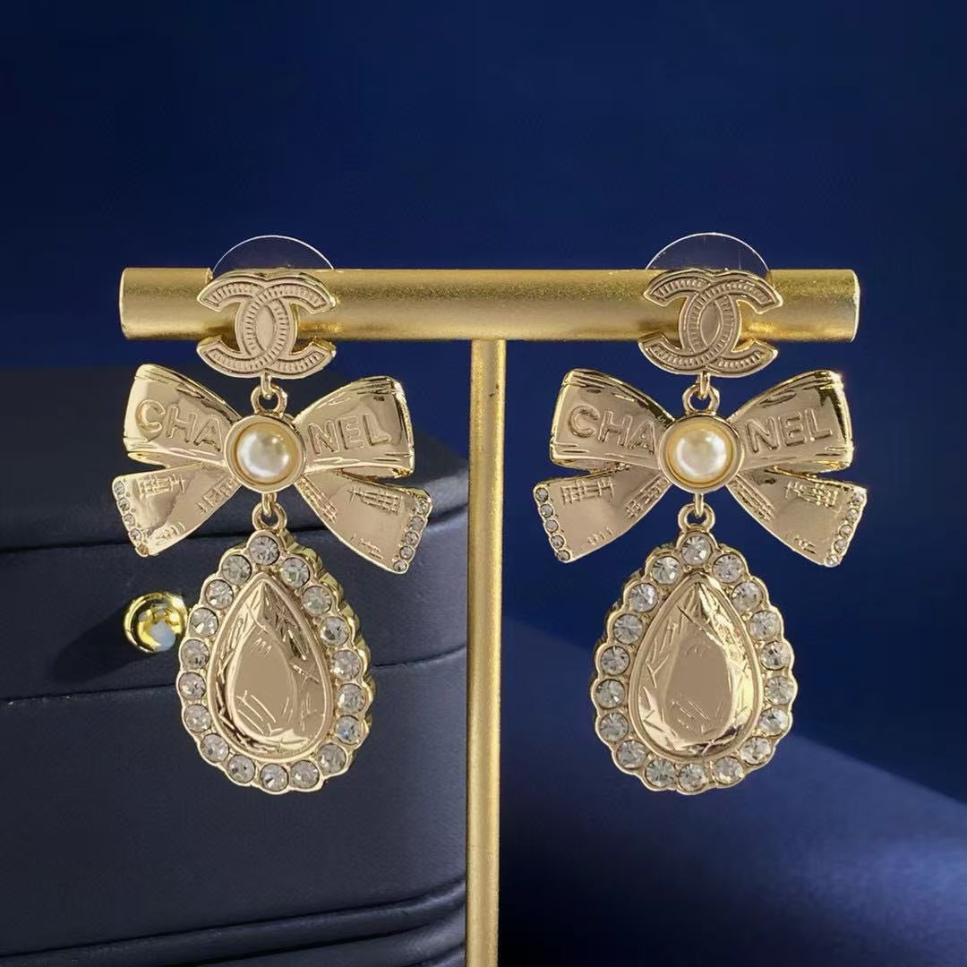 Double-C Emblem Stud Earrings in Gold-Tone – Design 038 detail view