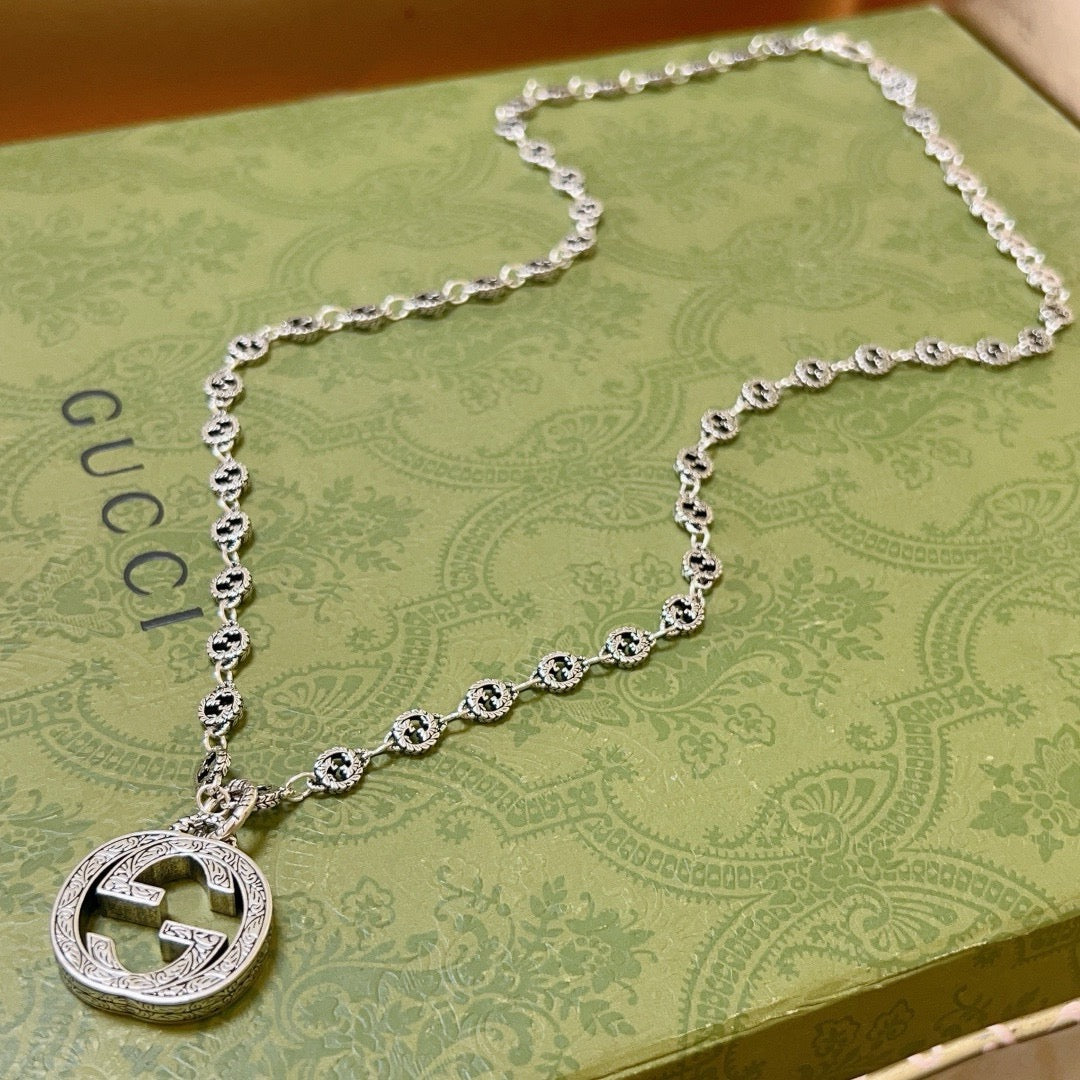 Double-G Emblem Pendant Necklace in Polished Metal-Tone – Vintage Detail – Design 023 close-up detail