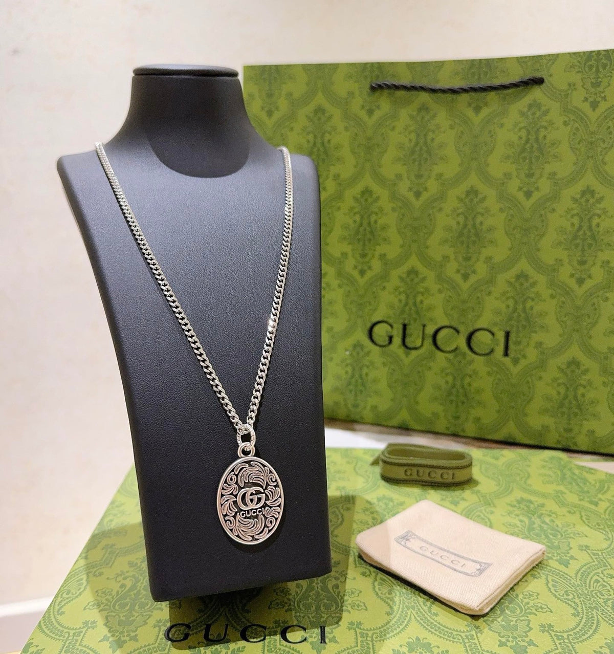 Double-G Emblem Pendant Necklace in Polished Metal-Tone – Design 200 side detail