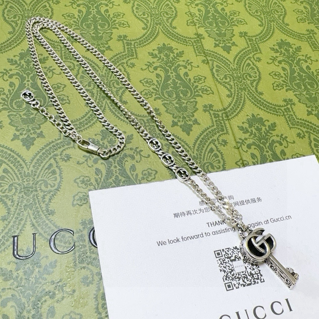 Double-G Emblem Pendant Necklace in Polished Metal-Tone – Vintage Detail – Design 055 side detail