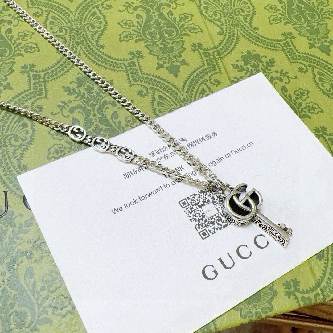 Double-G Emblem Pendant Necklace in Polished Metal-Tone – Vintage Detail – Design 058 main product view