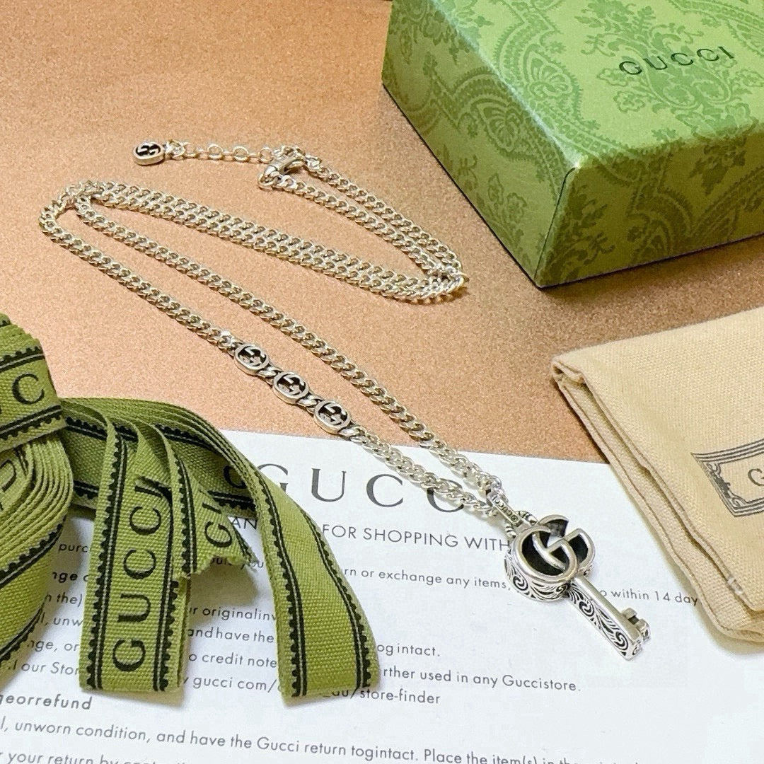 Double-G Emblem Pendant Necklace in Polished Metal-Tone – Vintage Detail – Design 022 close-up detail