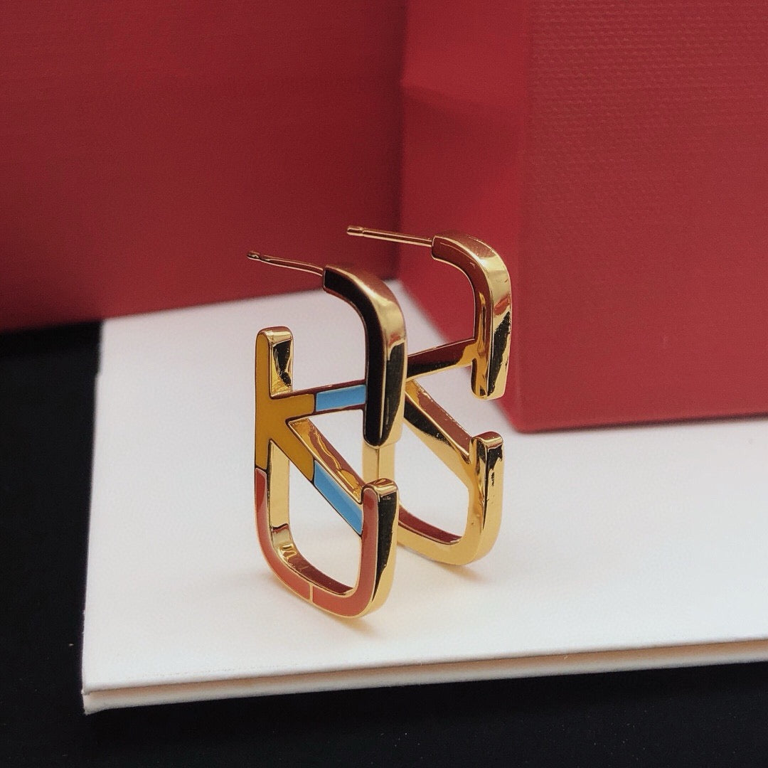Signature Emblem Stud Earrings in Polished Metal-Tone – Design 05 close-up view