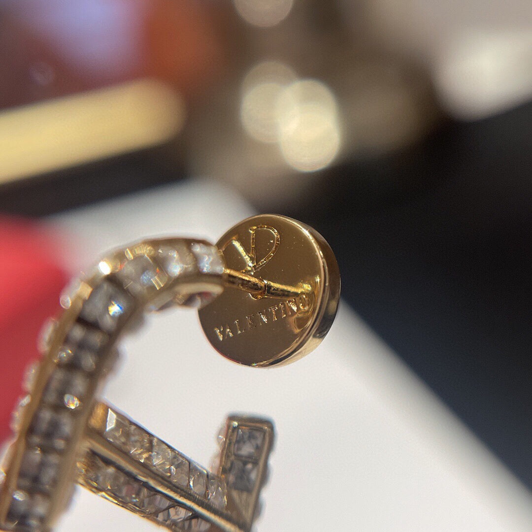 Signature Emblem Crystal-Accent Statement Earrings styled detail