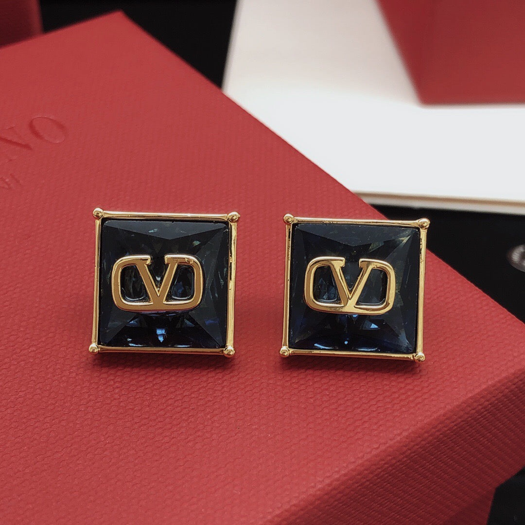 Signature Emblem Stud Earrings in Polished Metal-Tone – Red front view