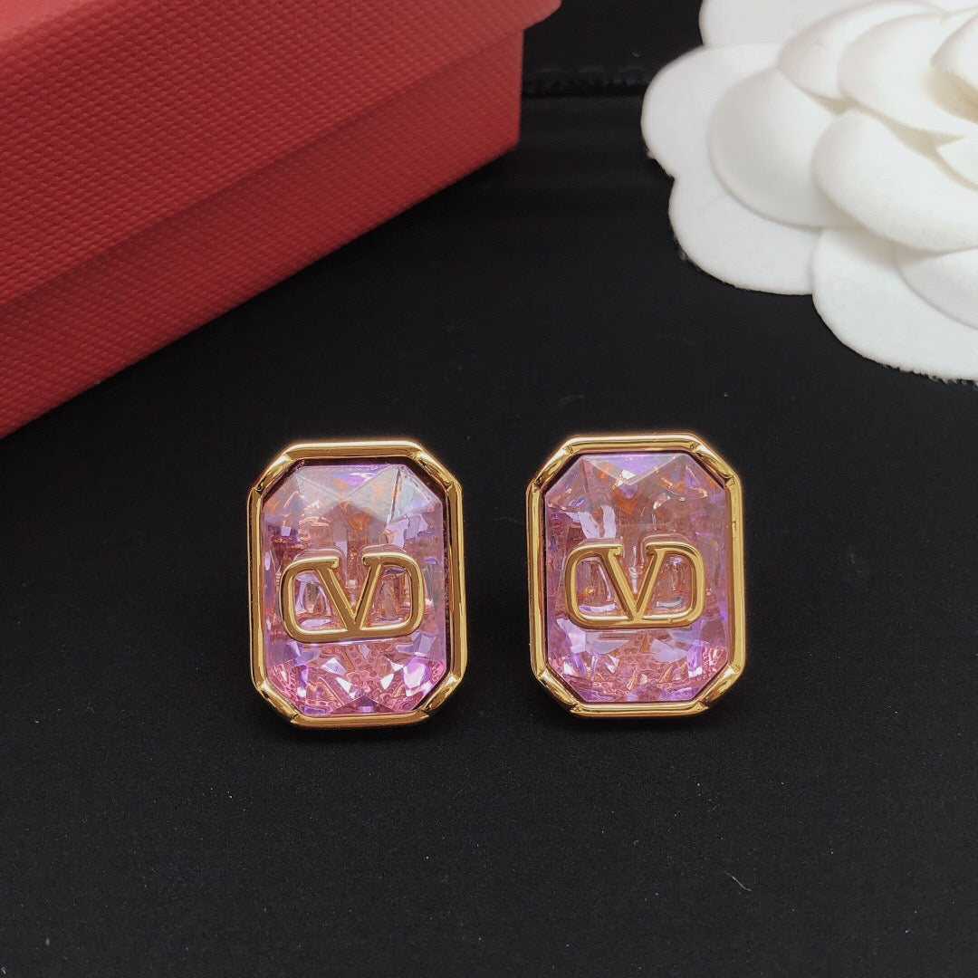 Signature Emblem Crystal-Accent Stud Earrings – Purple close-up view