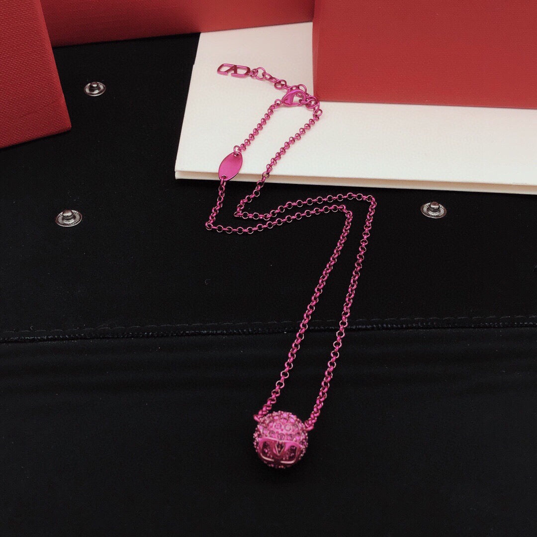 Signature Emblem Crystal-Accent Pendant Necklace – Purple front view