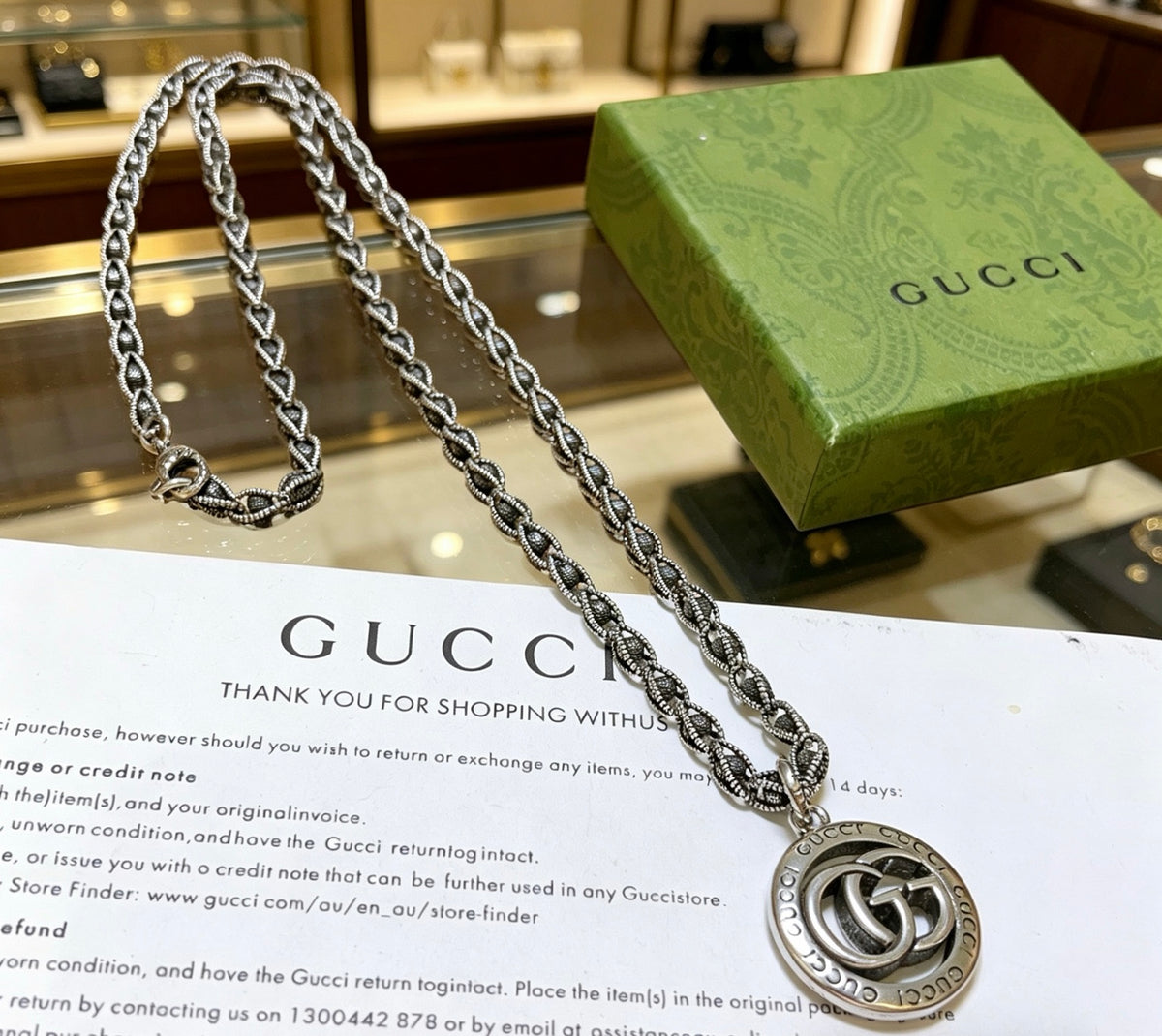 Double-G Emblem Pendant Necklace in Polished Metal-Tone – Vintage Detail – Design 038 close-up detail