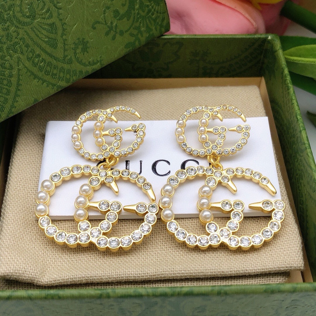 Double-G Emblem Stud Earrings in Polished Metal-Tone – Design 030 detail view