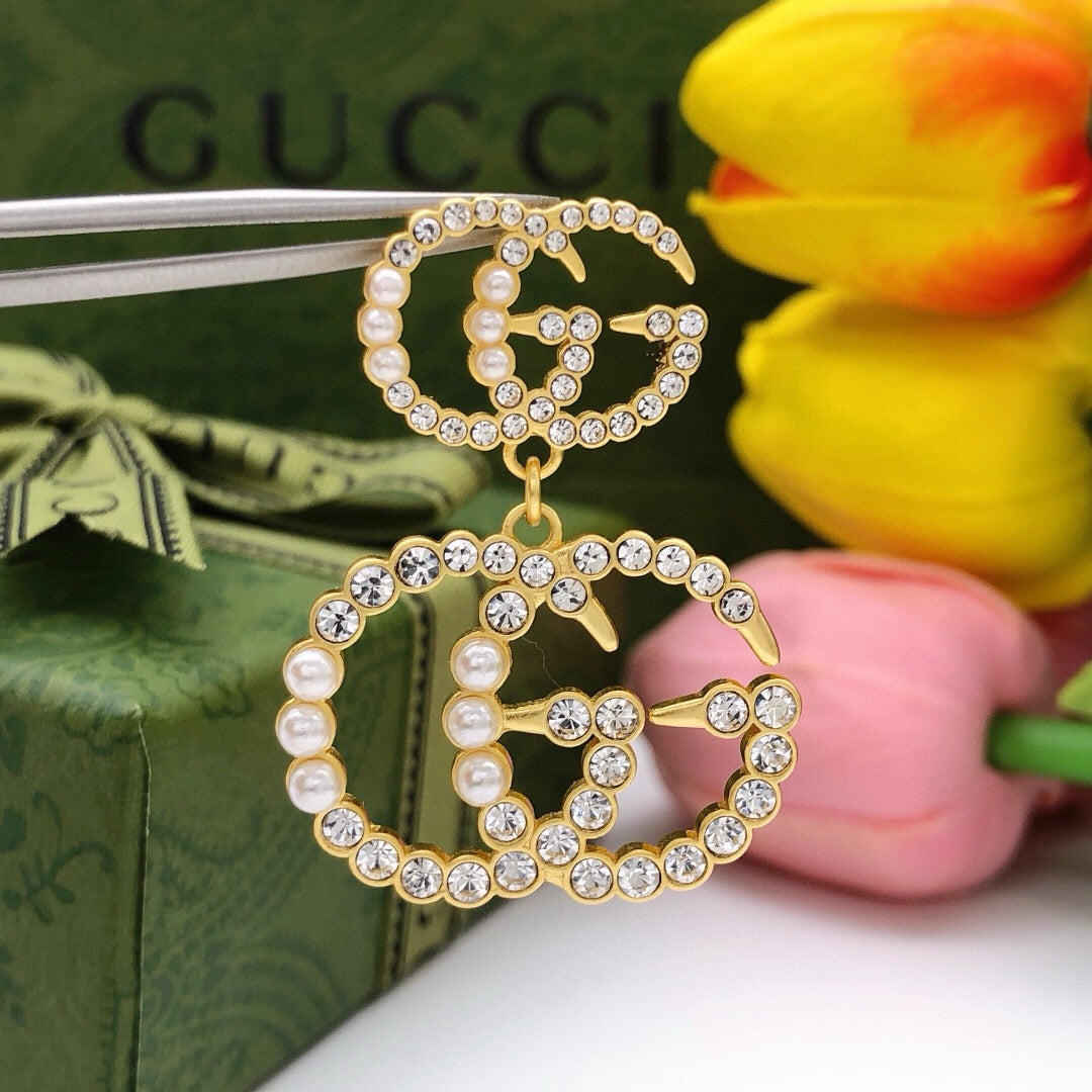 Double-G Emblem Stud Earrings in Polished Metal-Tone – Design 030 styled product view