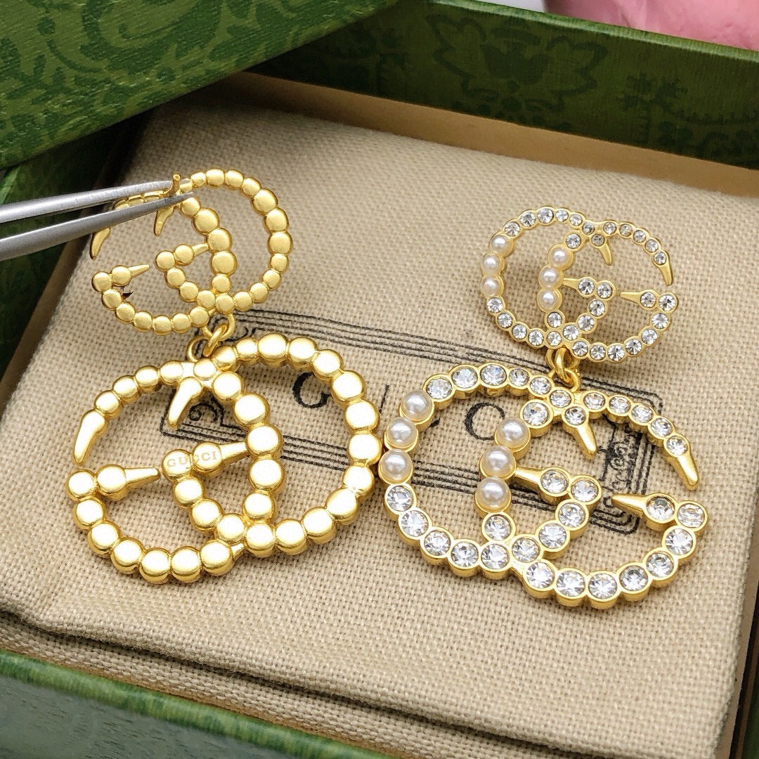 Double-G Emblem Stud Earrings in Polished Metal-Tone – Design 030 side detail