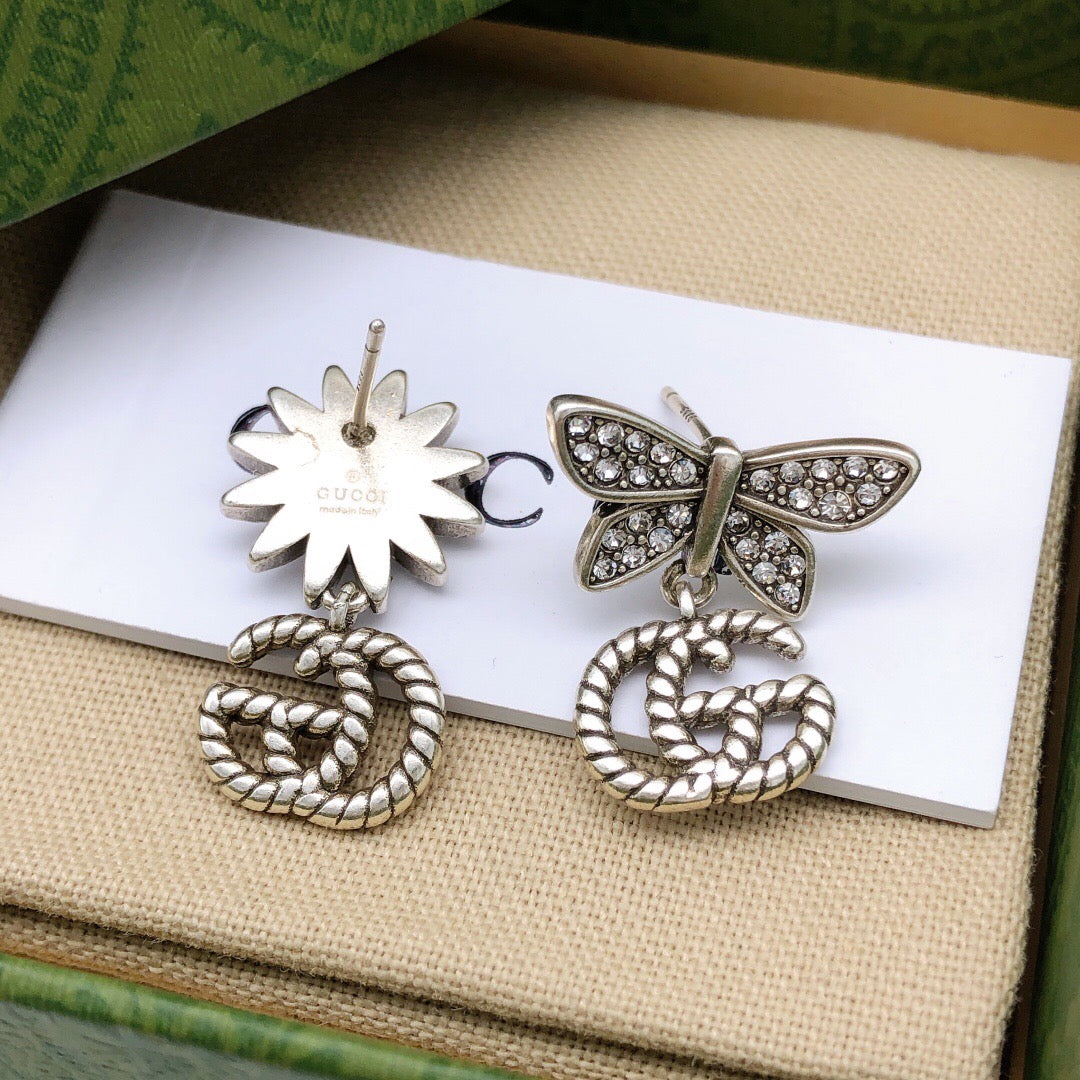 Double-G Emblem Stud Earrings in Polished Metal-Tone – Design 028 styled product view