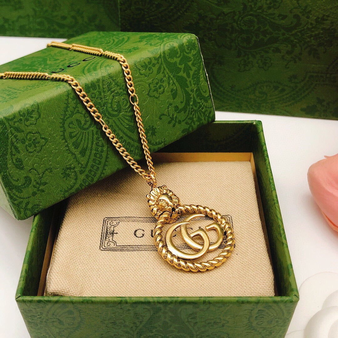 Double-G Emblem Pendant Necklace in Polished Metal-Tone – Vintage Detail – Design 037 close-up detail