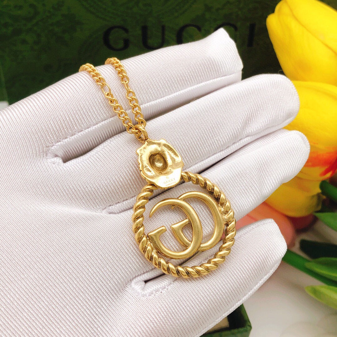 Double-G Emblem Pendant Necklace in Polished Metal-Tone – Vintage Detail – Design 037 detail view