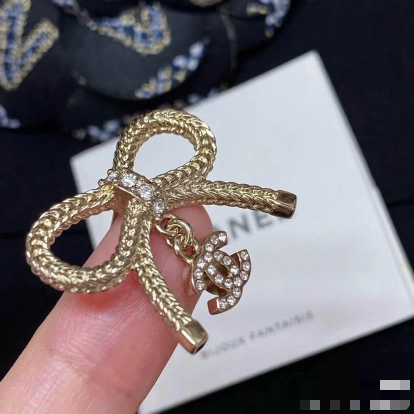 Double-C Emblem Stud Earrings in Polished Metal-Tone – Design 306 styled product view