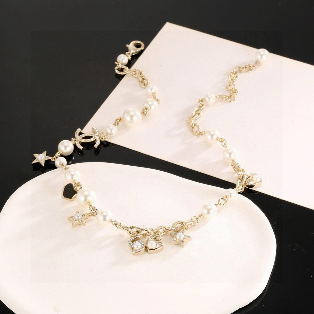Double-C Emblem Pendant Necklace in Polished Metal-Tone – Star Detail – Design 003 side detail