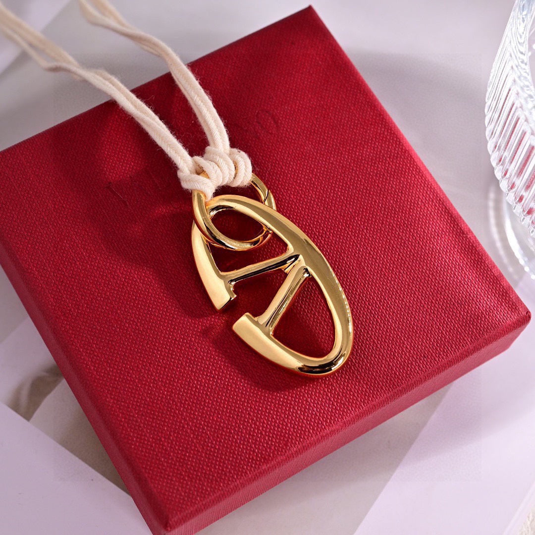 Signature Emblem Pendant Necklace in Polished Metal-Tone – Design 09 styled detail