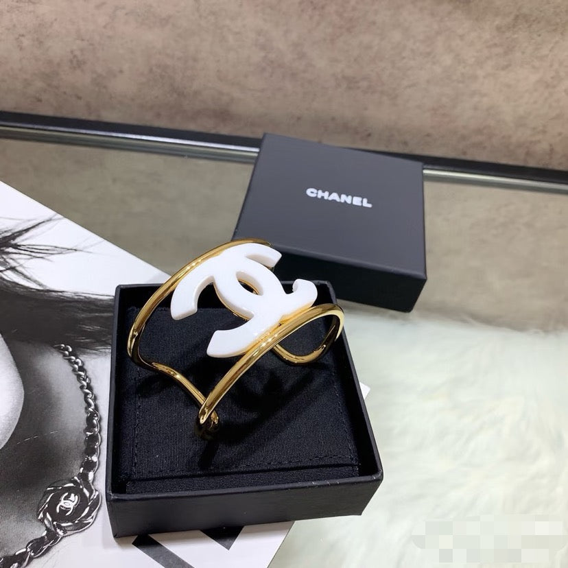 Signature Emblem Bangle in Polished Metal-Tone – White Detail – Design 003 detail view