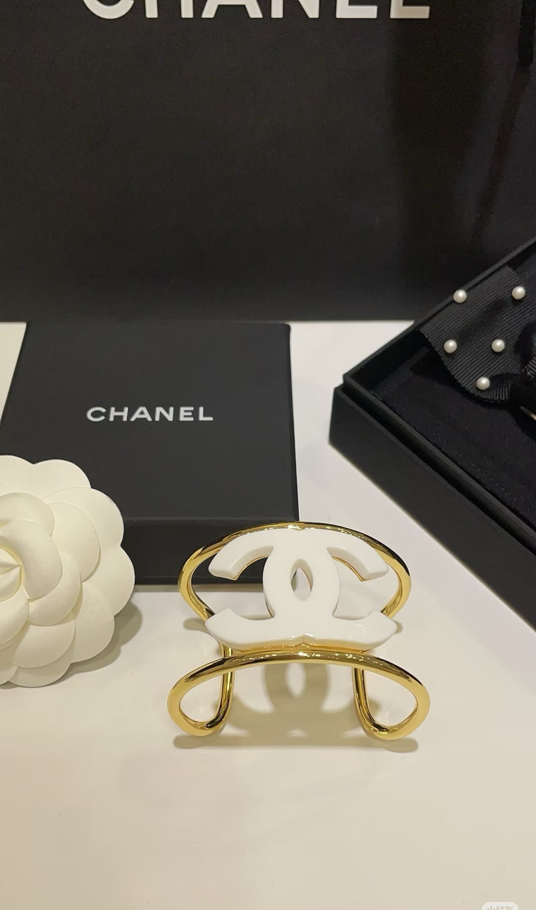 Signature Emblem Bangle in Polished Metal-Tone – White Detail – Design 003 front product view