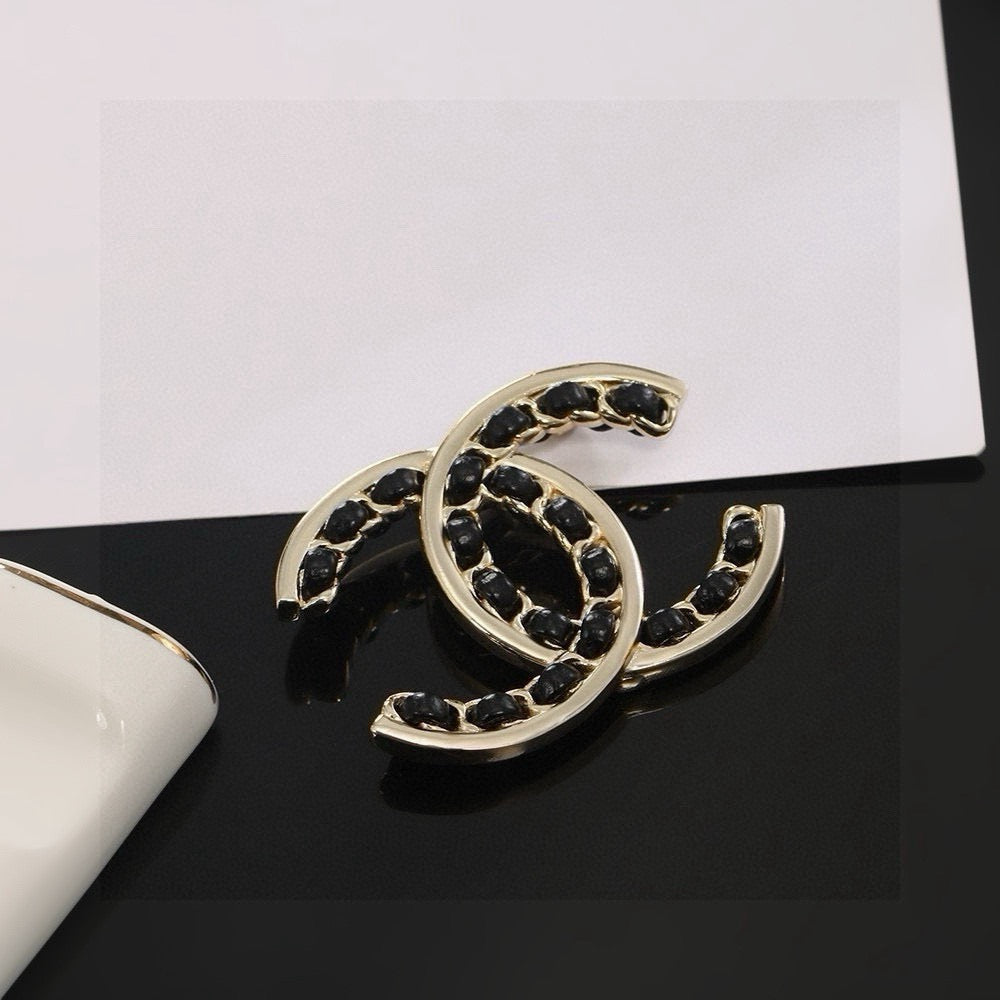 Double-C Emblem Brooch in Polished Metal-Tone – Black Detail main product view