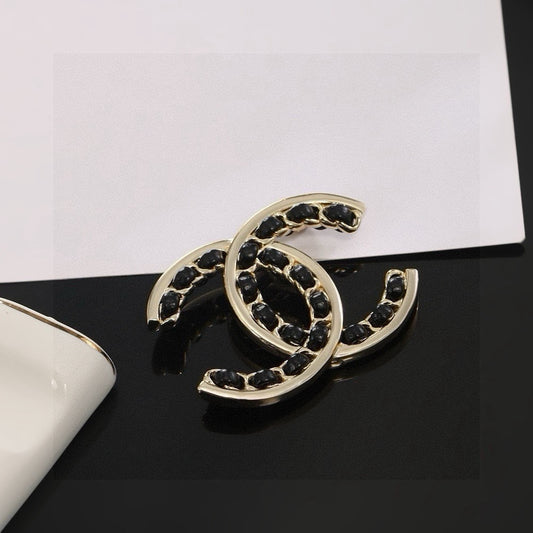 Double-C Emblem Brooch in Polished Metal-Tone – Black Detail main product view