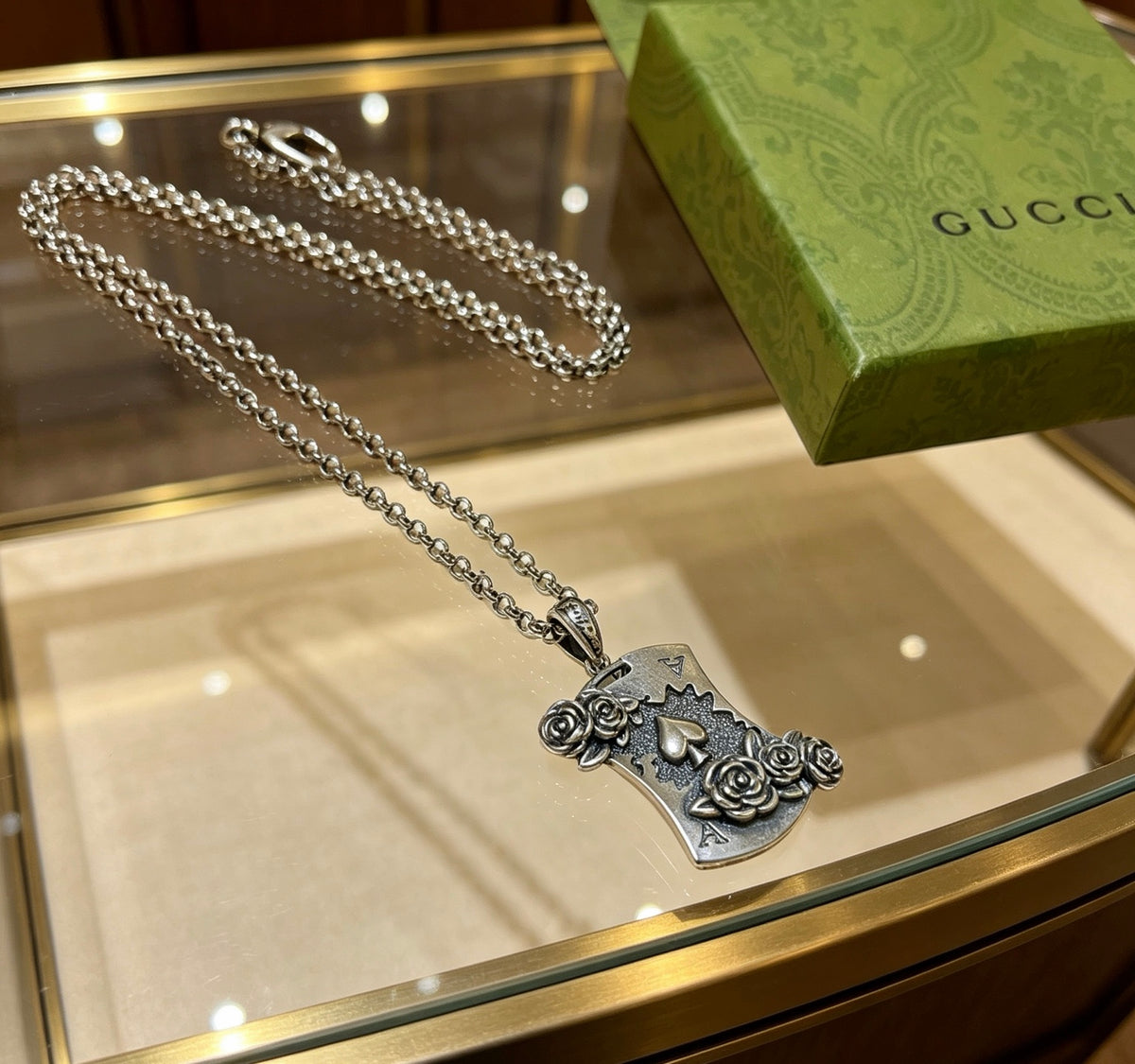 Double-G Emblem Pendant Necklace in Polished Metal-Tone – Vintage Detail – Design 046 close-up detail