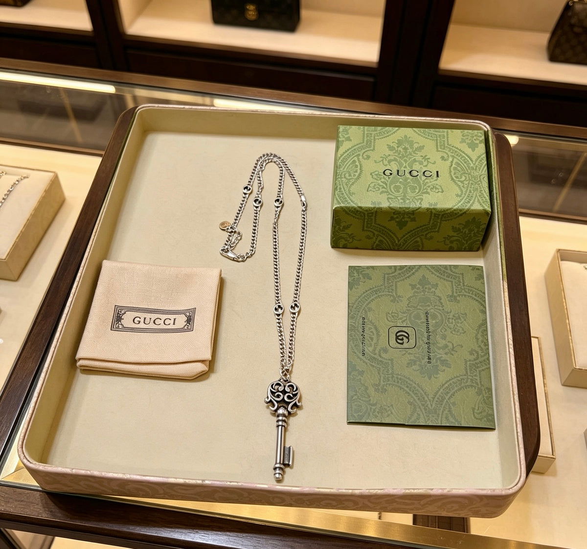 Double-G Emblem Pendant Necklace in Polished Metal-Tone – Vintage Detail – Design 062 close-up detail