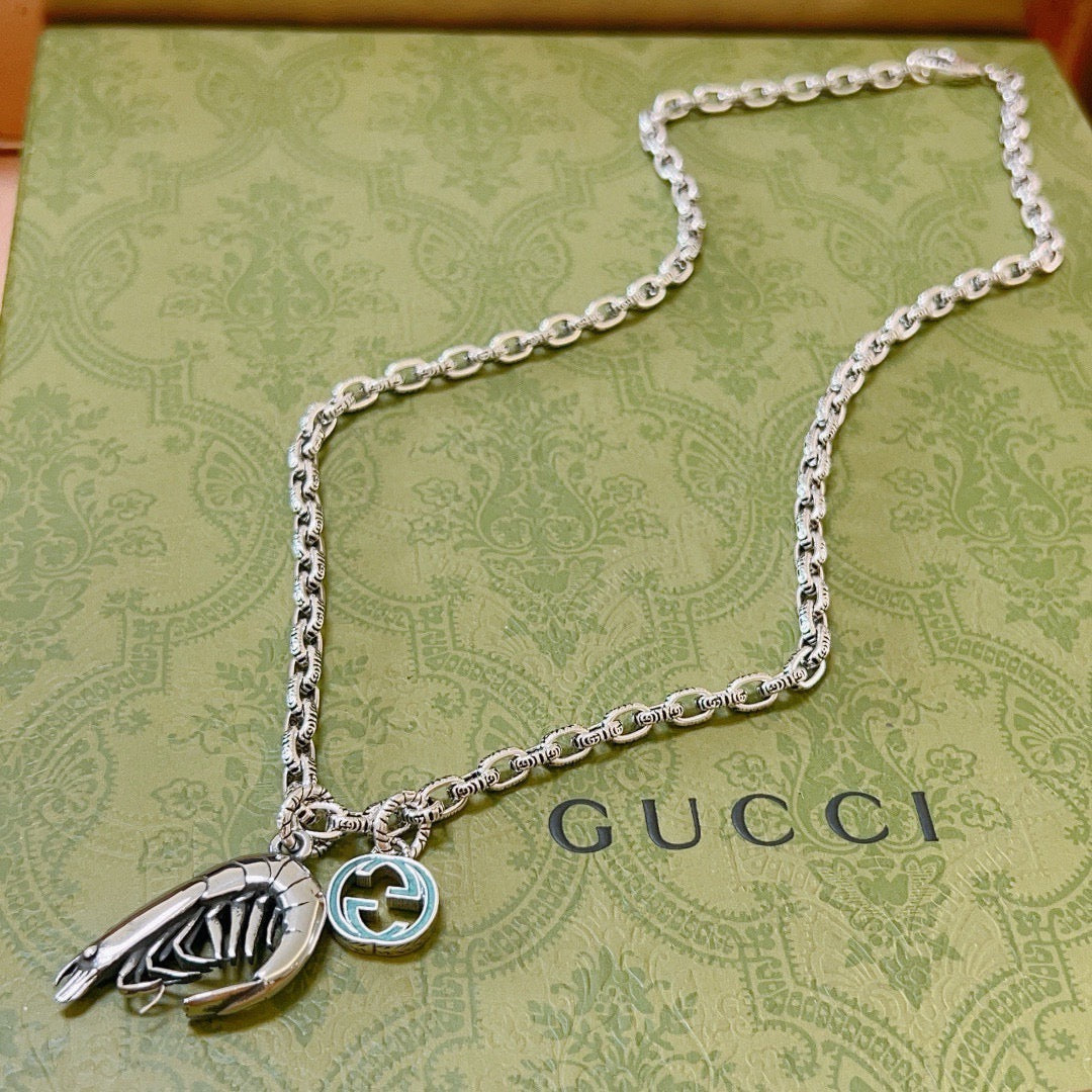 Double-G Emblem Pendant Necklace in Polished Metal-Tone – Vintage Detail – Design 068 detail view