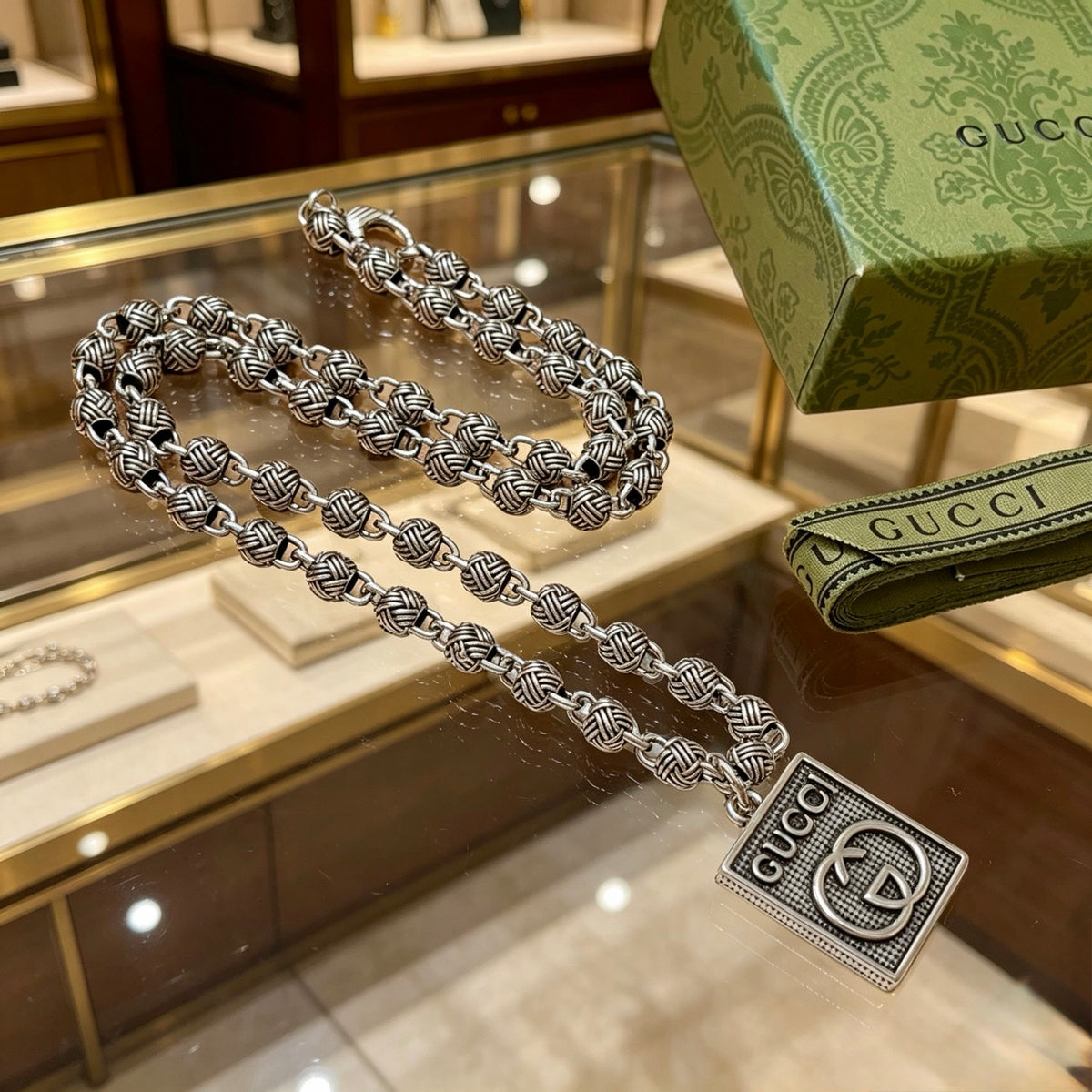 Double-G Emblem Pendant Necklace in Polished Metal-Tone – Design 220 side detail