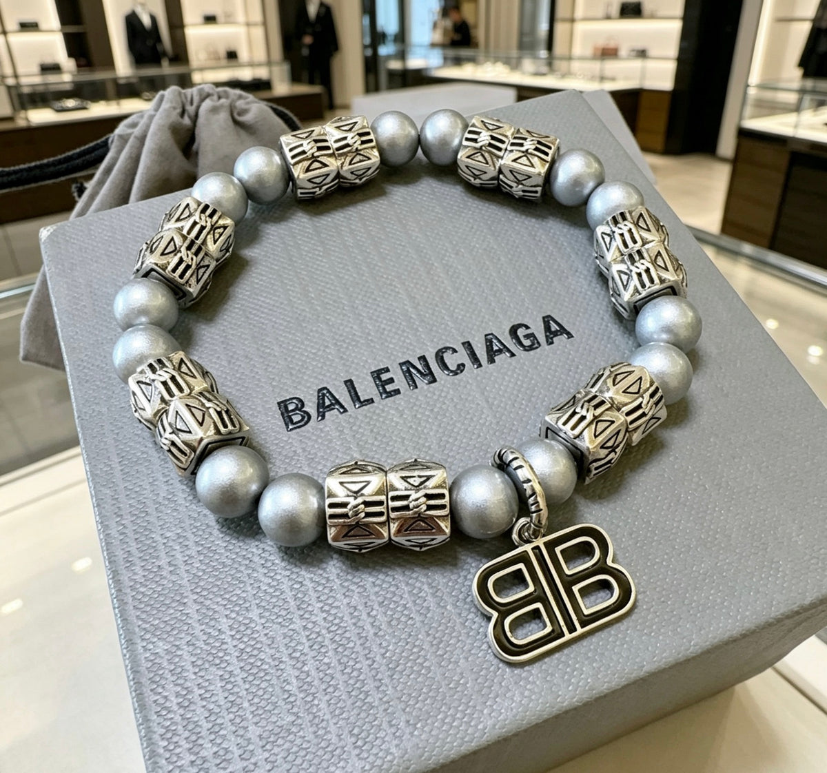 Geometric Emblem Bracelet in Polished Metal-Tone – Pearl Detail close-up detail