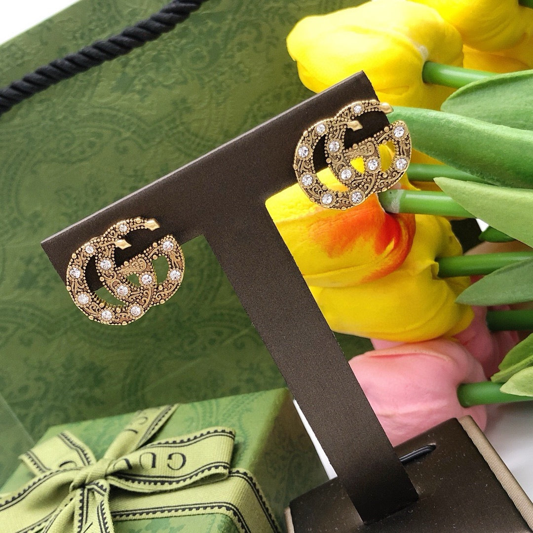 Double-G Emblem Stud Earrings in Gold-Tone – Vintage Detail styled product view
