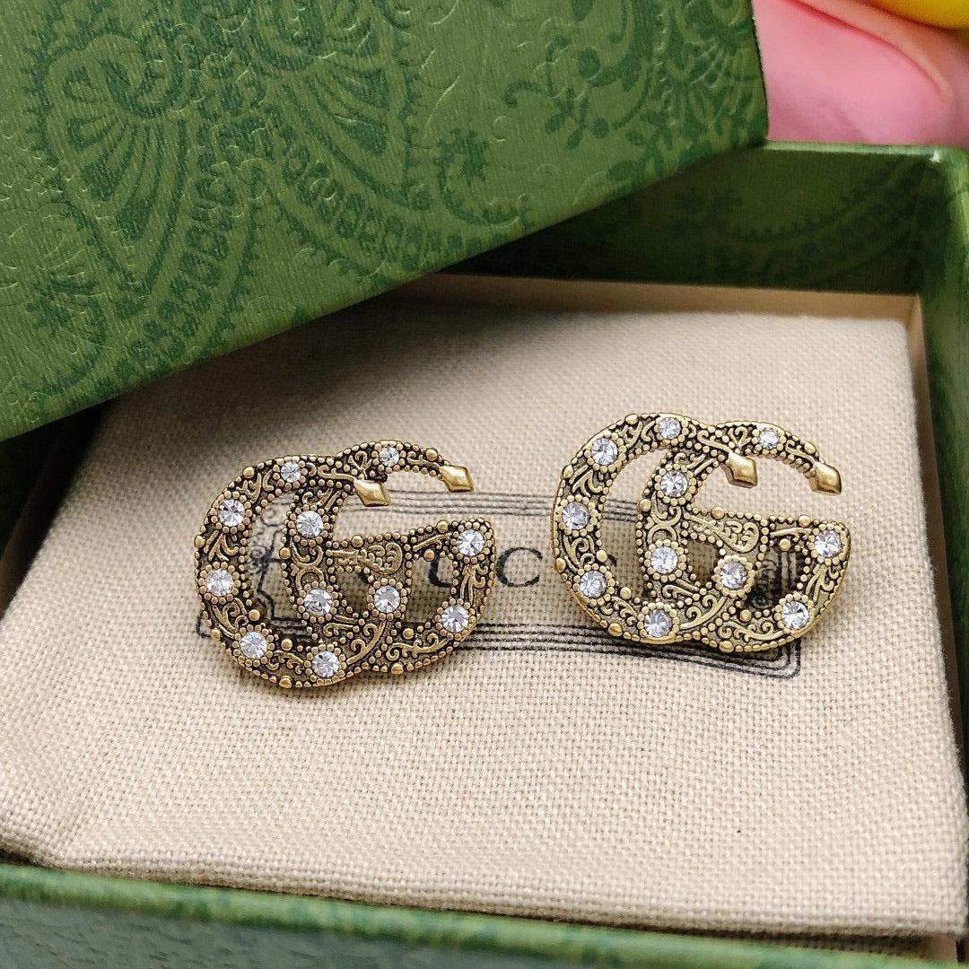 Double-G Emblem Stud Earrings in Gold-Tone – Vintage Detail front product view