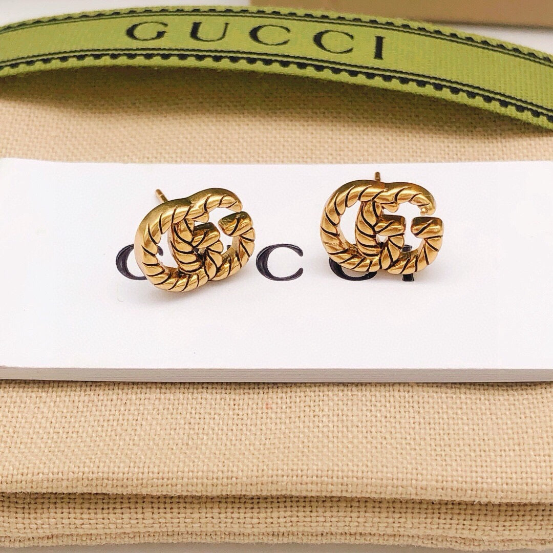 Double-G Emblem Stud Earrings in Polished Metal-Tone – Design 034 detail view