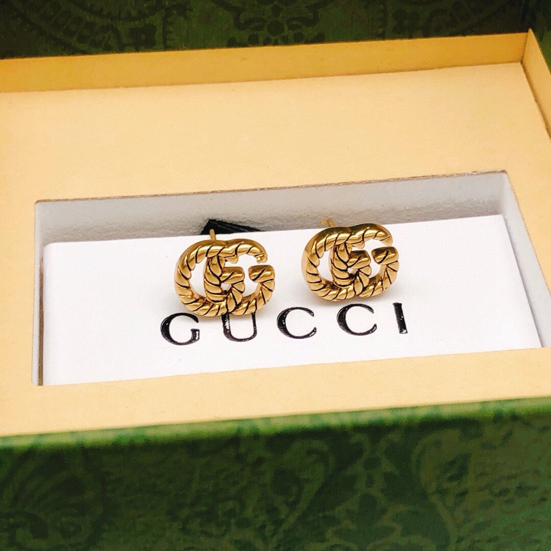 Double-G Emblem Stud Earrings in Polished Metal-Tone – Design 034 styled product view