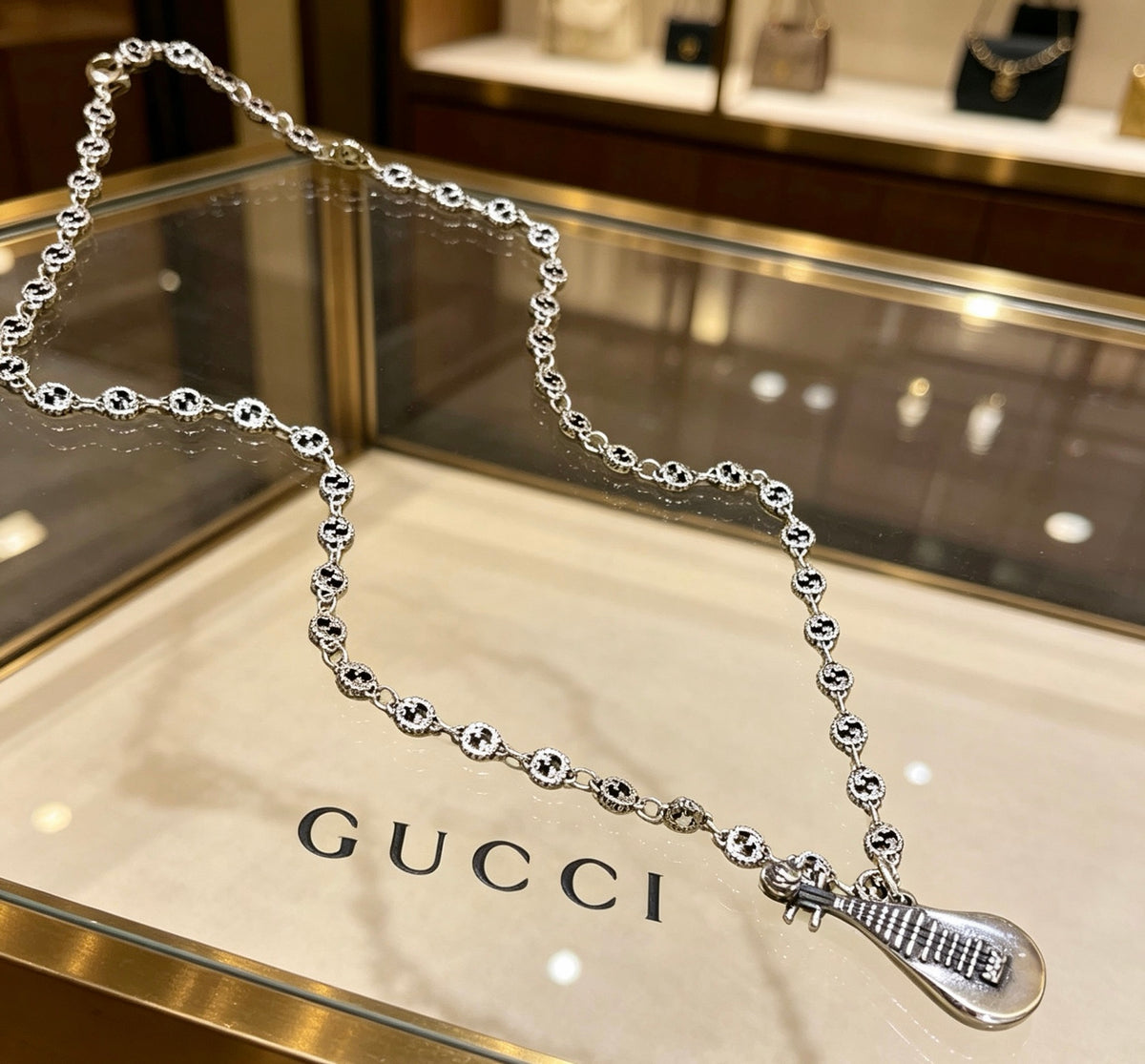 Double-G Emblem Pendant Necklace in Polished Metal-Tone – Design 230 main product view