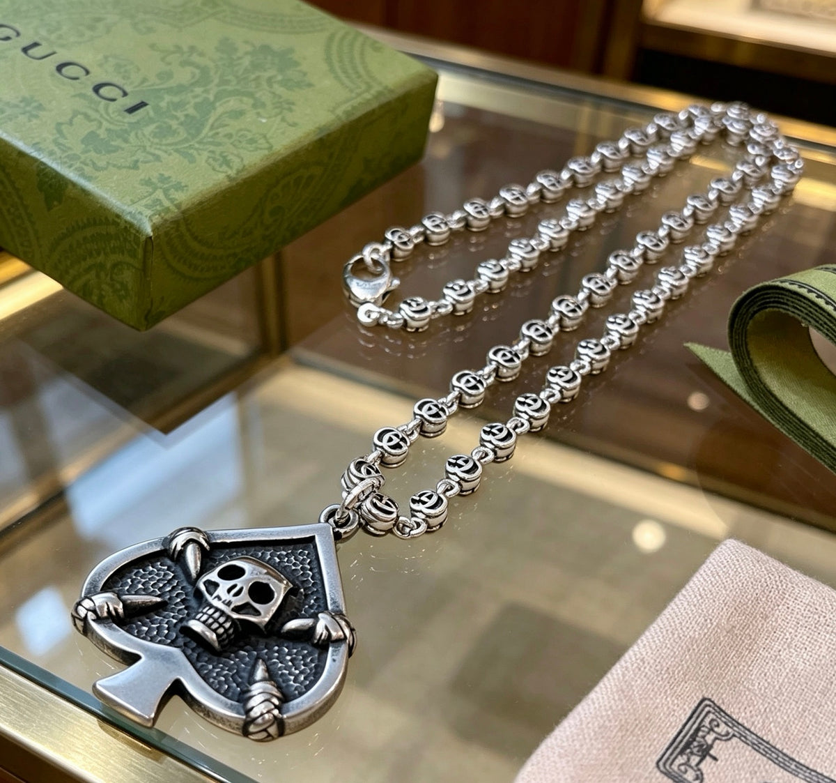 Double-G Emblem Pendant Necklace in Polished Metal-Tone – Vintage Detail – Design 069 close-up detail