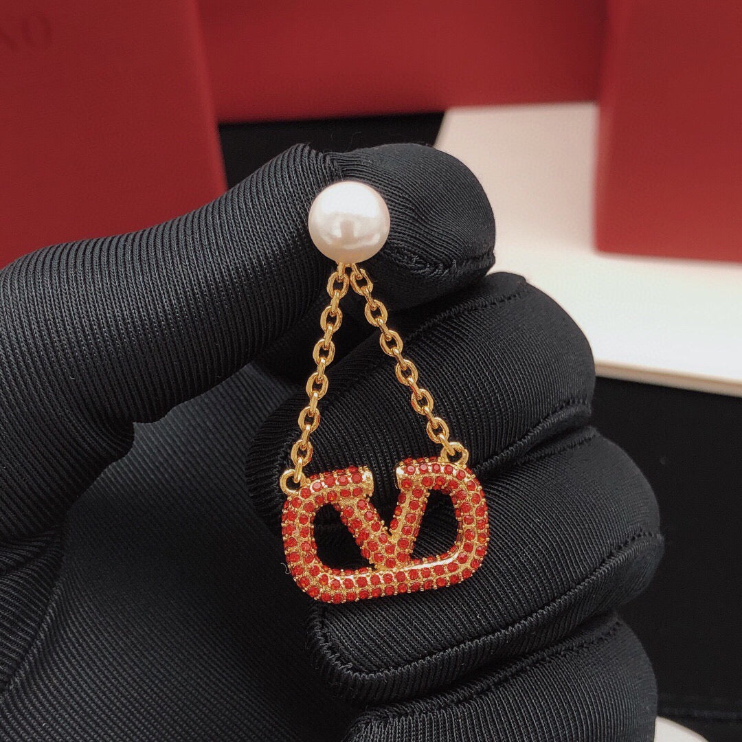Signature Emblem Crystal-Accent Stud Earrings – Red – Design 02 styled detail