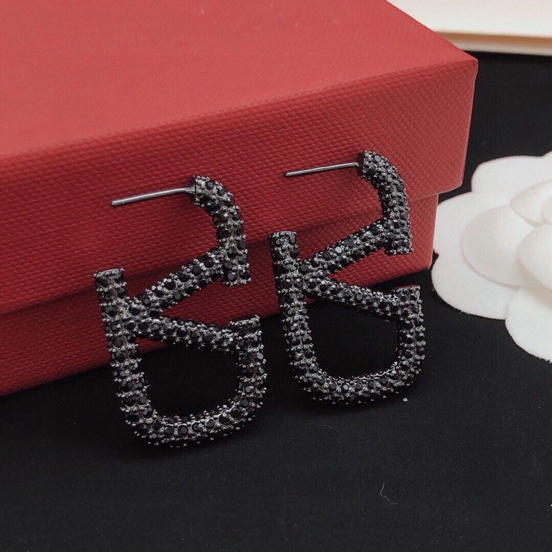 Signature Emblem Crystal-Accent Stud Earrings – Black – Design 02 styled detail