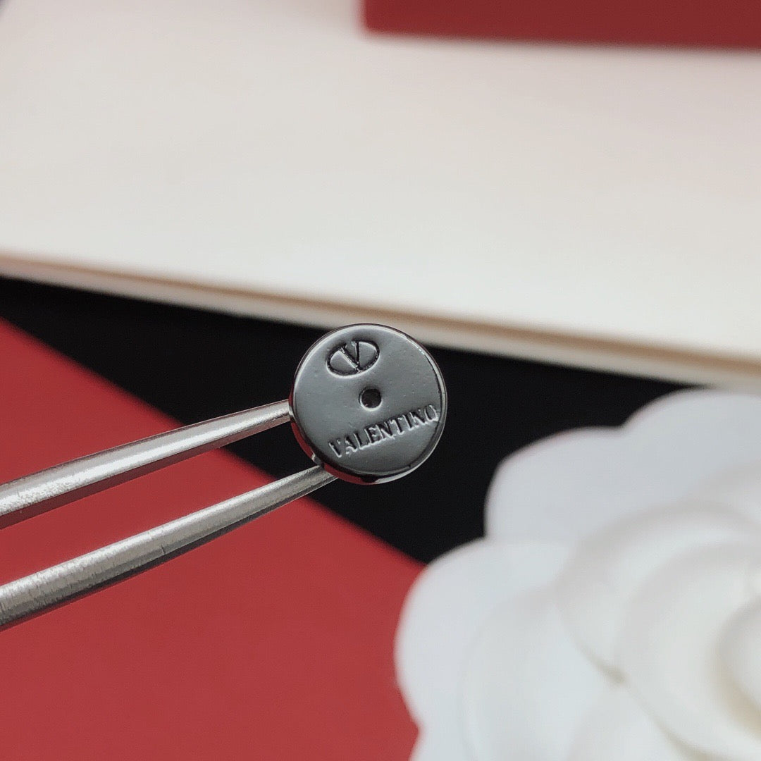 V Emblem Jewelry Accessory – Black close-up view