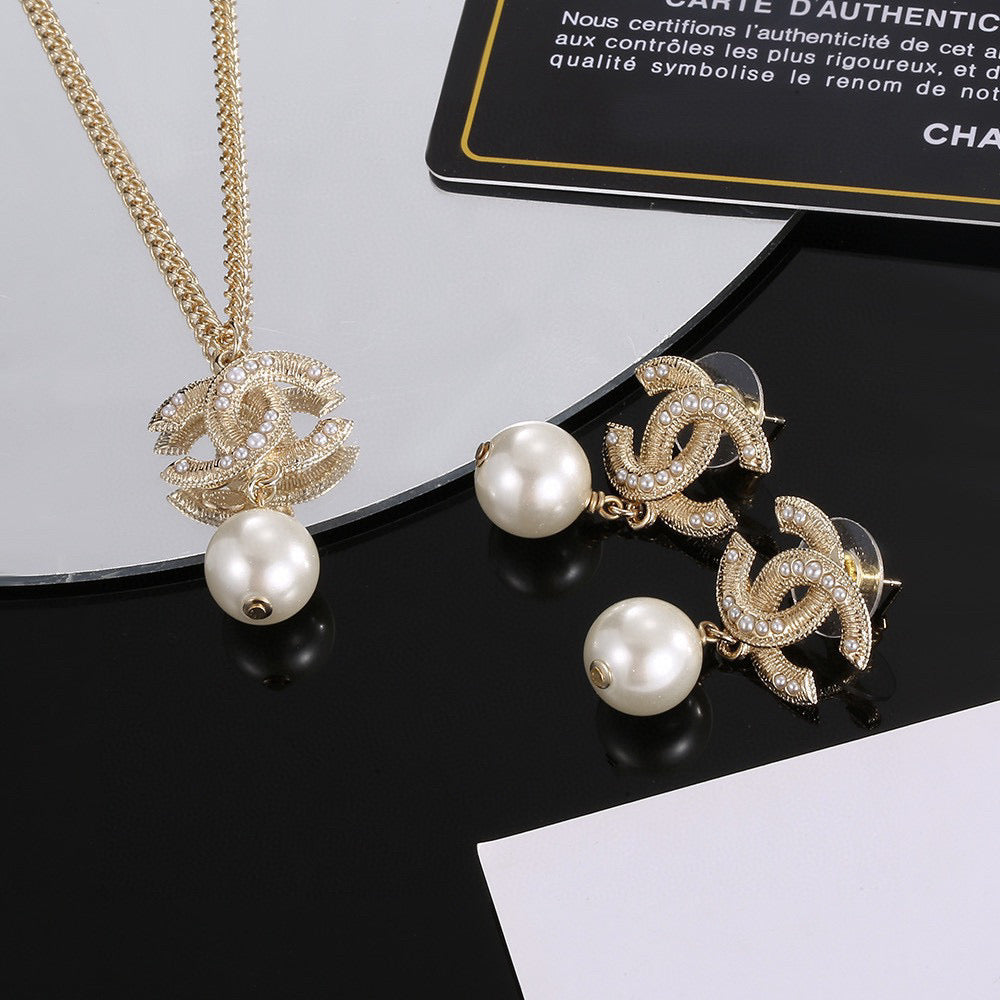 Double-C Emblem Pearl-Detail Pendant Necklace – Pearl Detail – Design 130 close-up detail