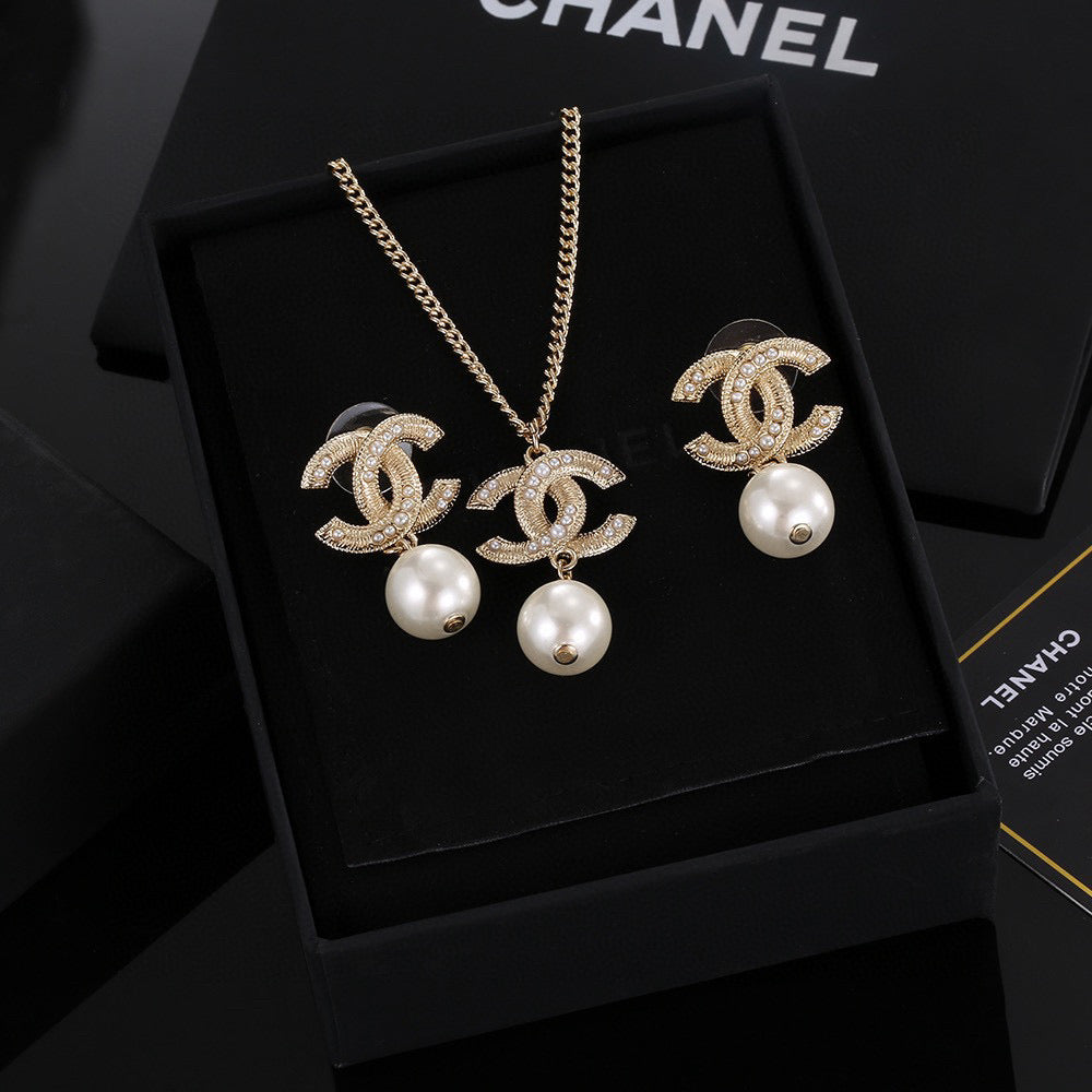 Double-C Emblem Pearl-Detail Pendant Necklace – Pearl Detail – Design 130 detail view