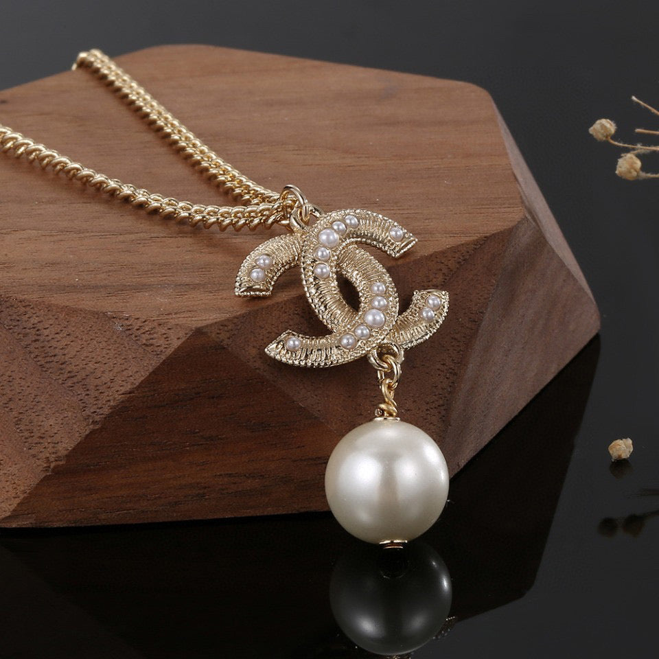 Double-C Emblem Pearl-Detail Pendant Necklace – Pearl Detail – Design 130 side detail