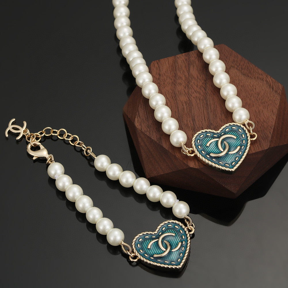 Double-C Emblem Bracelet in Polished Metal-Tone – Pearl Detail – Design 003 main product view