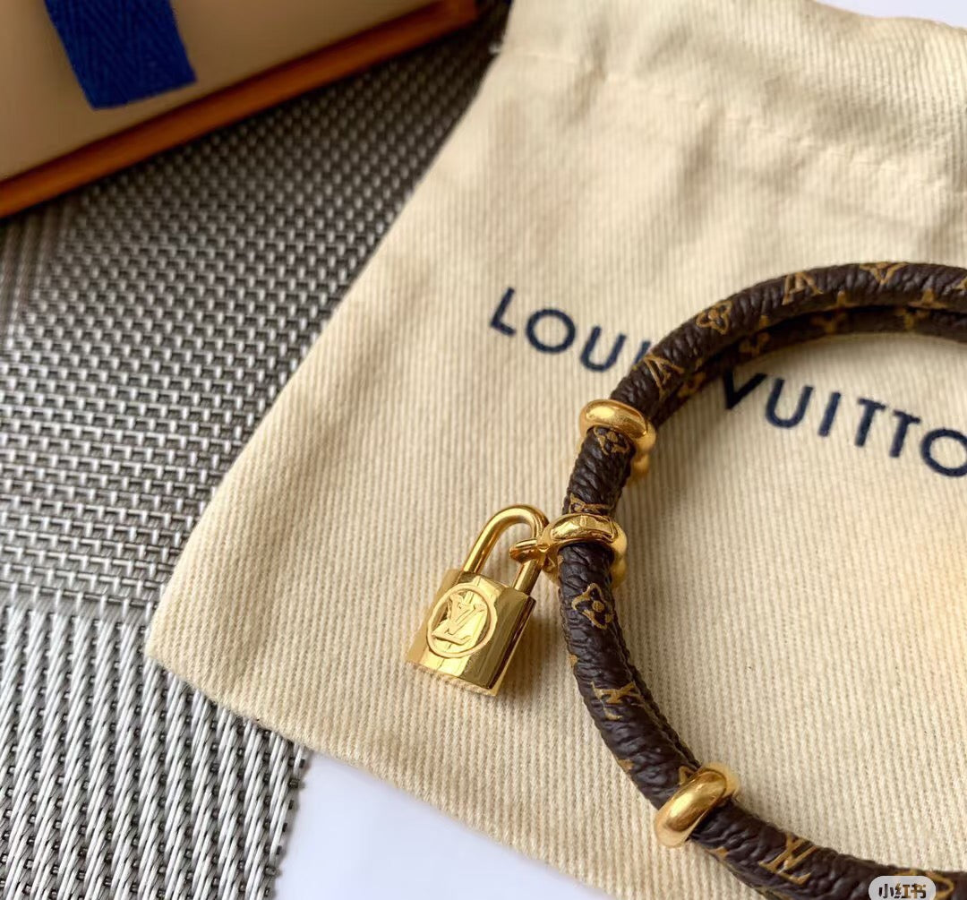 Letter Emblem Bangle in Polished Metal-Tone – Leather Detail front product view