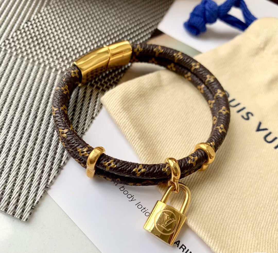Letter Emblem Bangle in Polished Metal-Tone – Leather Detail detail view